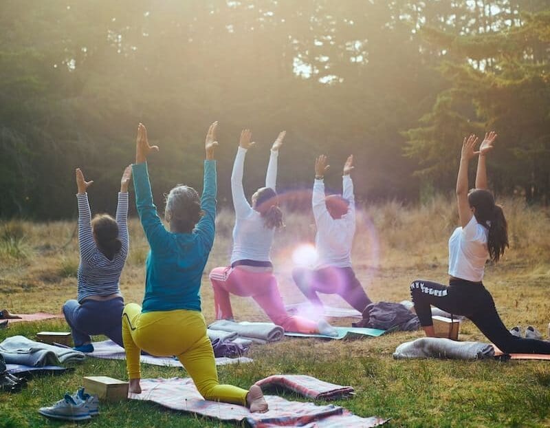 group of people raising their hands